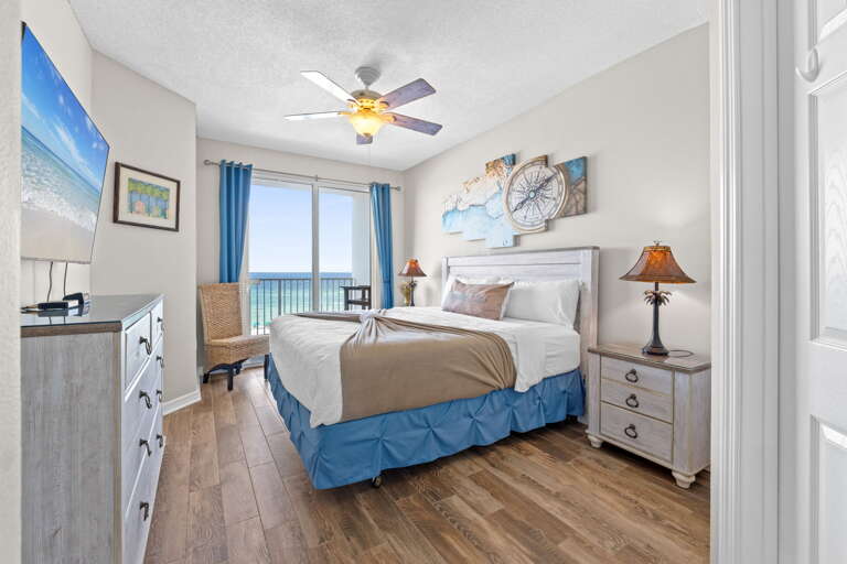 King size bed in this primary bedroom with private access to the balcony 