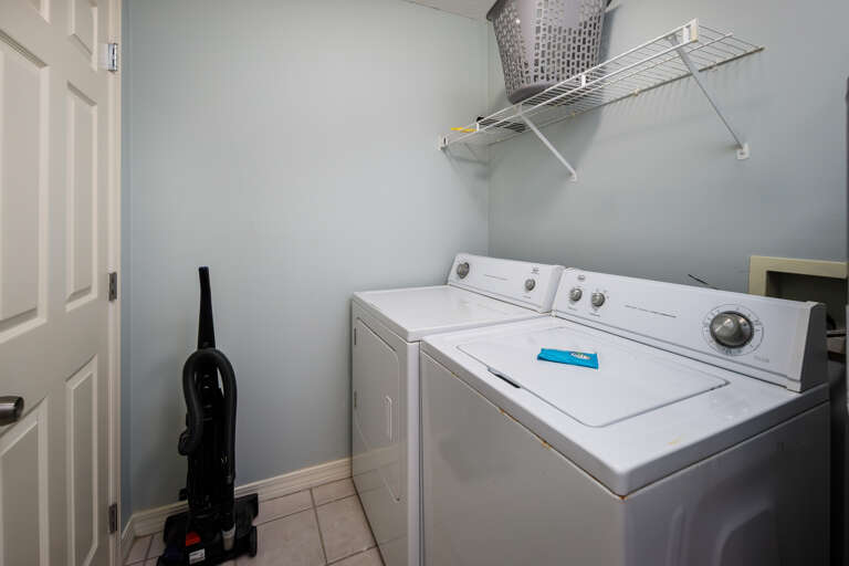 A full-sized washer and dryer can be found in the condo's utility room