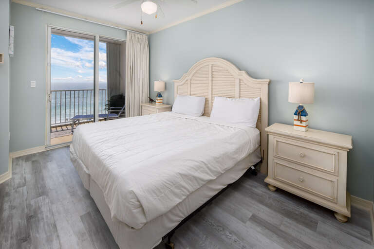  king size bed and a large flat screen TV