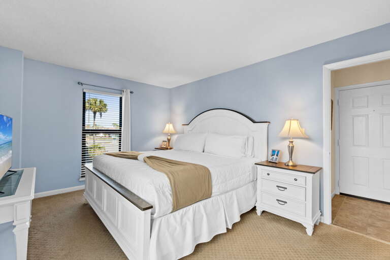 Spacious master suite with a king size bed.