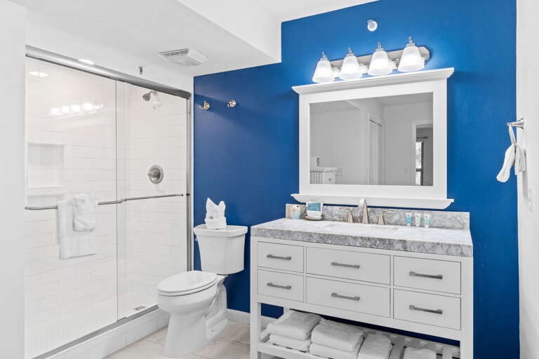 Gorgeous walk in shower with granite counter tops and flooring