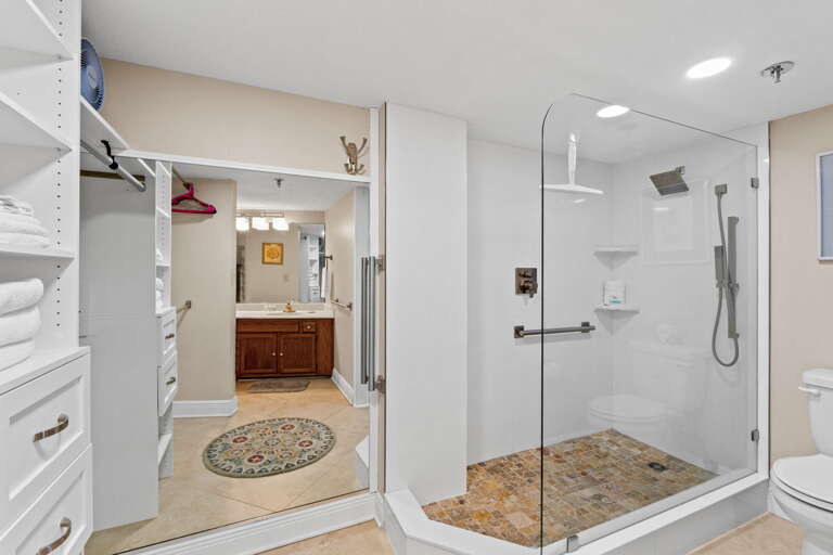 With a walk in shower and a large closet area.