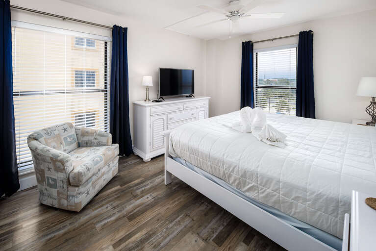 This bedroom has a TV & a window for some Florida sunshine!