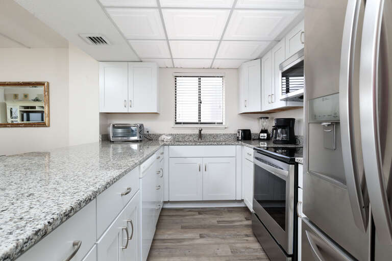 This unit features stainless steel appliances & lots of cabinet and counter space 