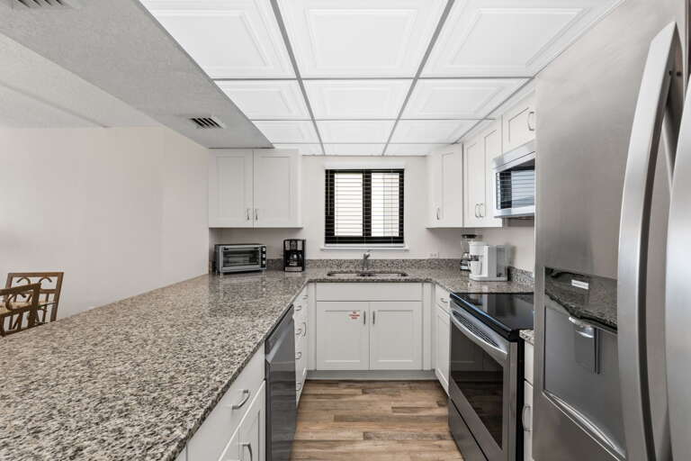This unit features stainless steel appliances & lots of cabinet and counter space 