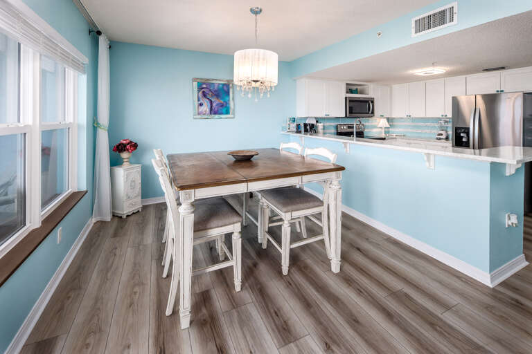 The dinning room table located next to the kitchen for your convenience