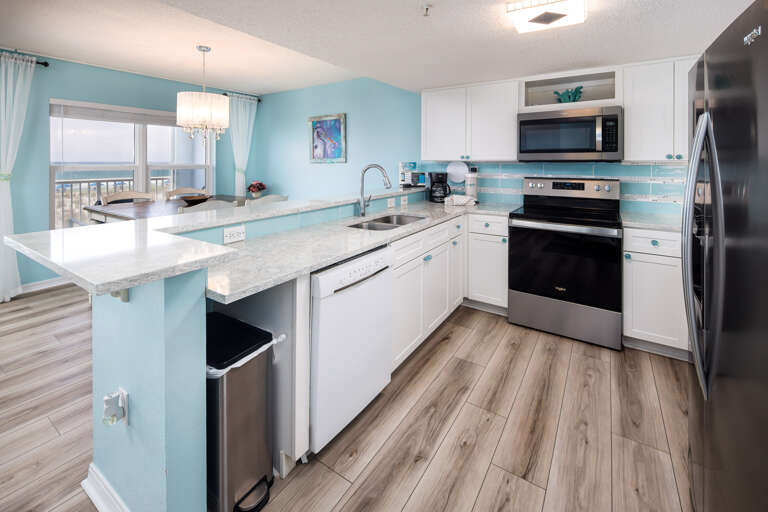 This unit features a stainless steel stove & refrigerator with lots of cabinet & counter space. 