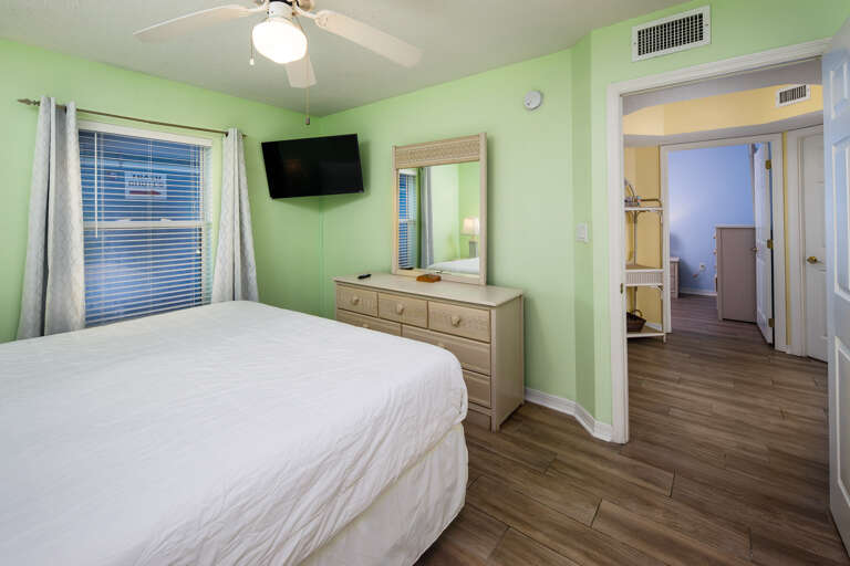 The Master Bedroom has a full en suite bath and a King sized bed facing a mounted TV  The Master Bedroom has a full en suite bath and a King sized bed facing a mounted TV