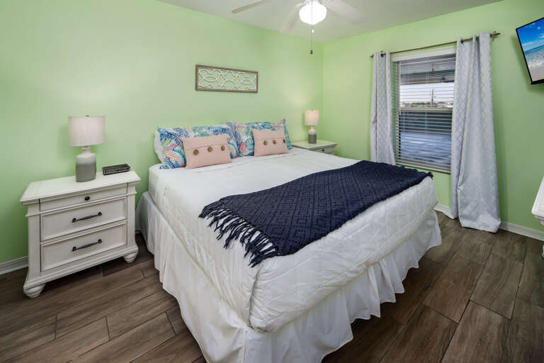 Featuring a comfy king size bed, this master bedroom will be the perfect spot for resting after a fun and tiring day on the beach.