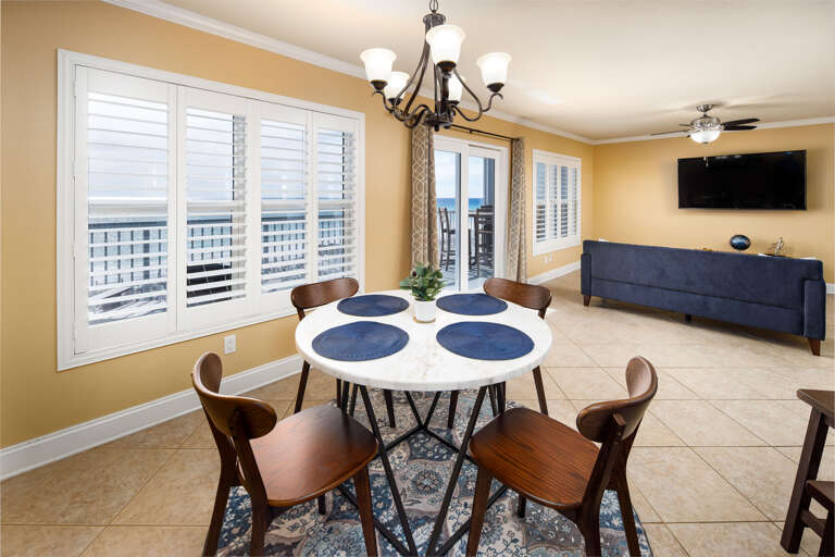 The windows from the living and dining areas gives a wide beachfront view from this amazing condo.