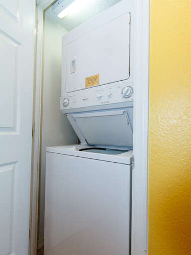 Featuring a stackable washer/dryer for your laundry needs.