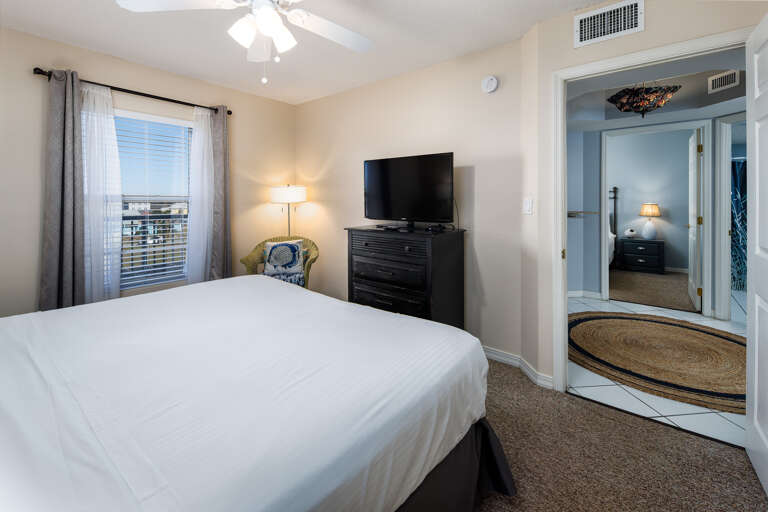 Facing a flat screen TV with a private bathroom to the side Facing a flat screen TV with a private bathroom to the side