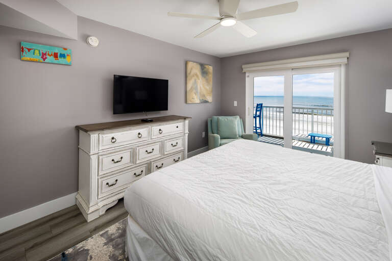 The King bed faces a flat screen TV with a private bathroom to the side The King bed faces a flat screen TV with a private bathroom to the side