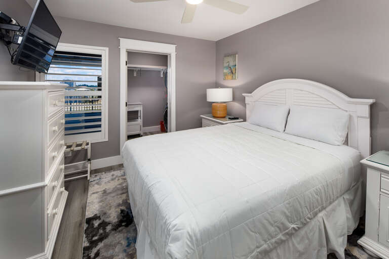 Second Bedroom features a Queen bed and mounted TV Second Bedroom features a Queen bed and mounted TV