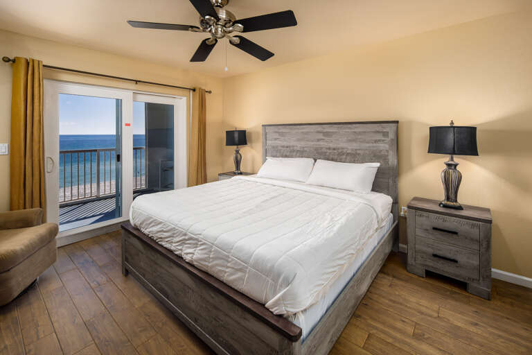 There is beautiful furniture & flooring in this master bedroom. Sleep in comfort.