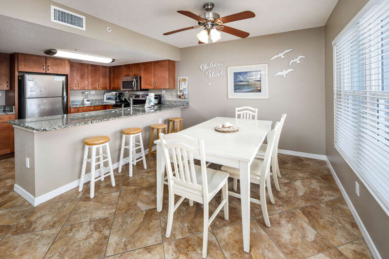 The dining room table is located next to the kitchen for your convenience