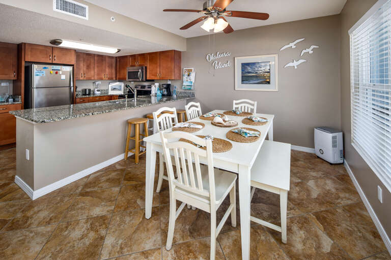 The dining room table is located next to the kitchen for your convenience