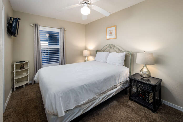 Wall mounted TV and a window for the Florida sunshine 