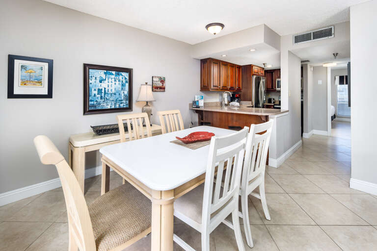 The dining room table located next to the kitchen for your convenience