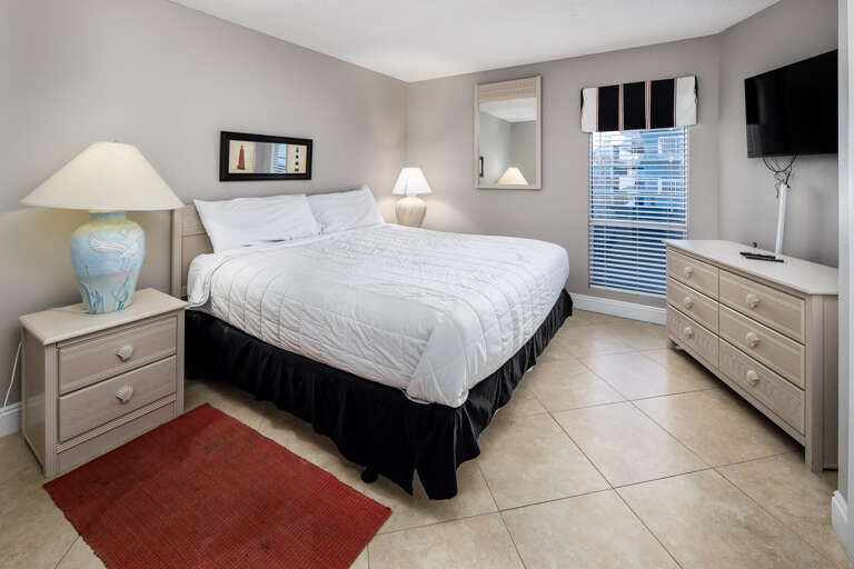 This spacious bedroom has a comfy King sized bed