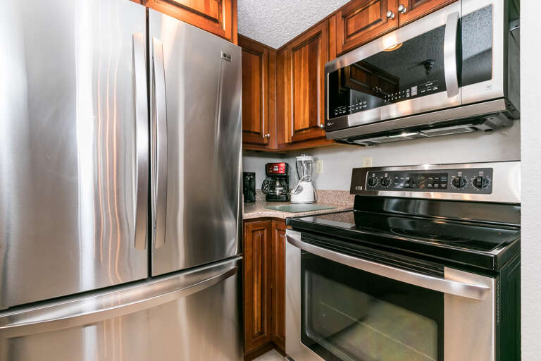 Stainless steel appliances and beautiful wooden cabinetry 