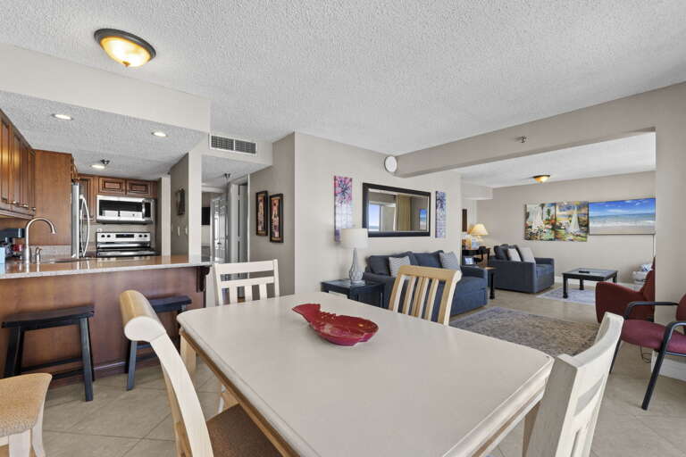 The dining room table is located next to the kitchen for your convenience.