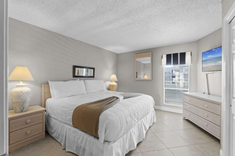 This spacious bedroom has a comfy King sized bed