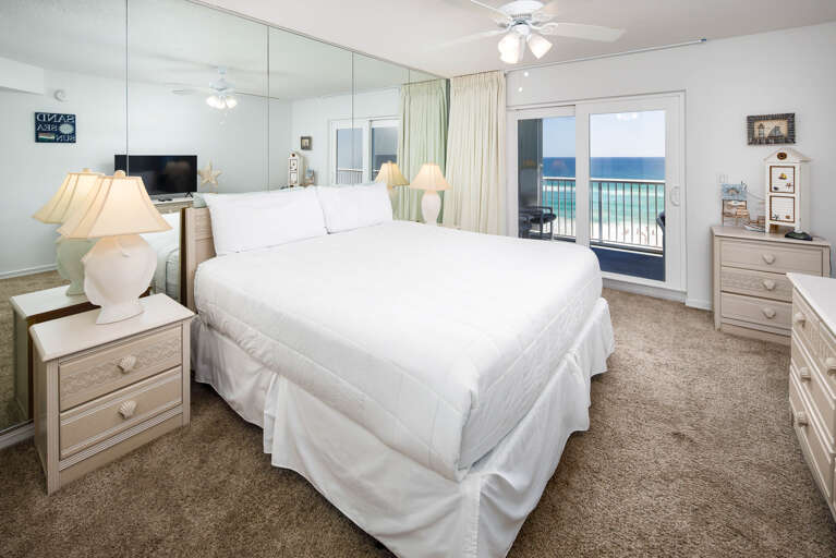Features a king bed, full bath, and access to the balcony with a beach front view