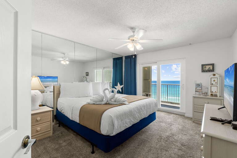 Features a king bed, full bath, and access to the balcony with a beach front view