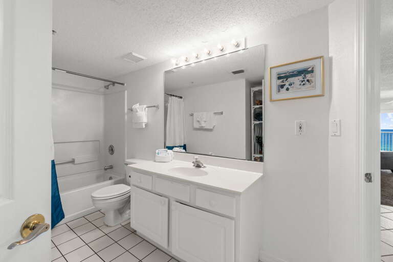 Featurs a shower/tub combo and access from the third bedroom and the hall.