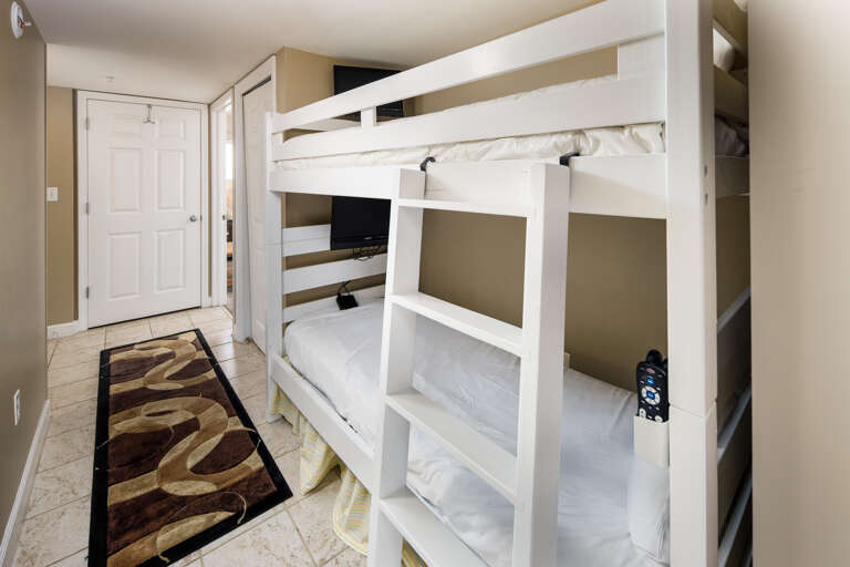 To the extreme delight of our younger guests, the bunk area features two flat-screen TVs, one for each bunk!