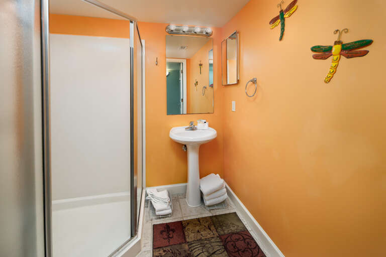 This walk in octagon shower is a unique part of this unit