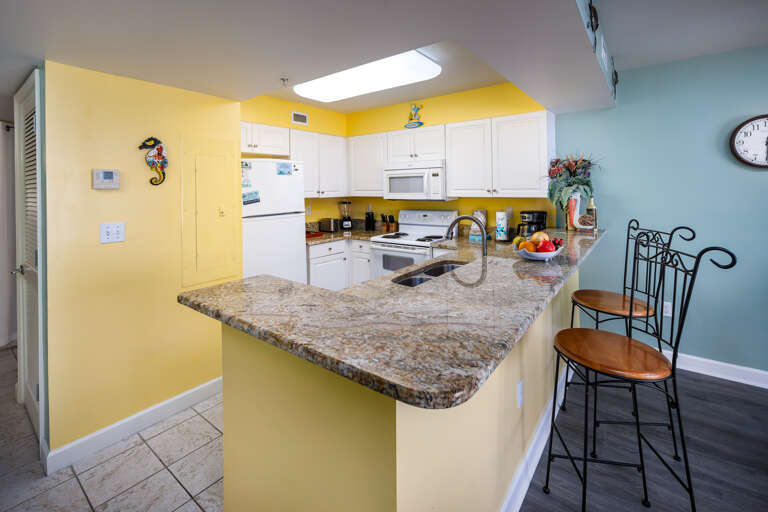 Additional seating at the breakfast bar are convenient for a quick snack or beverage. 