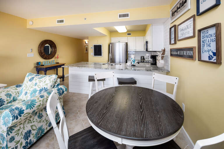 Seating for four, with additional seating at the kitchen island.