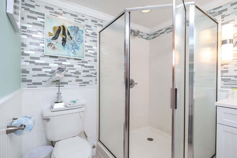 Second full bathroom accessible from hallway.