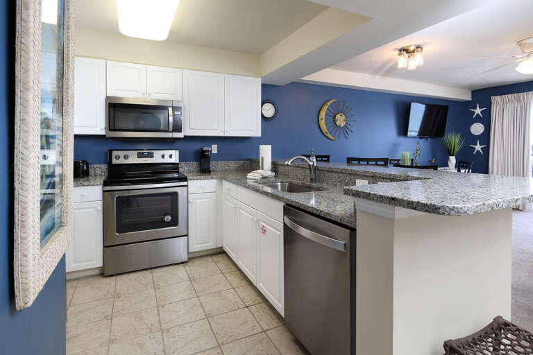 The full kitchen has both large and small appliances  including the much appreciated dishwasher!