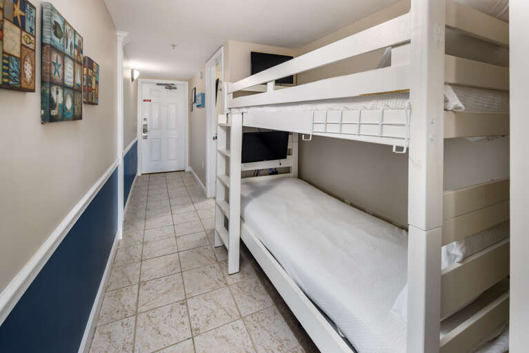 View of the bunk beds with TVs for each bunk.  View of the bunk beds with TVs for each bunk.