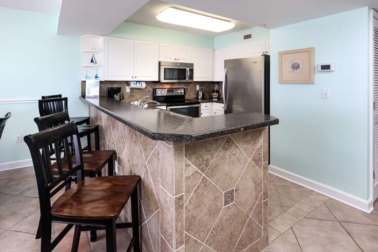 This Amazing unit offers bar stools for additional seating 