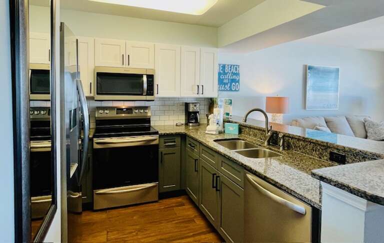 Brushed nickel hardware and newer cabinet paint make the kitchen in 510 unbeatable.