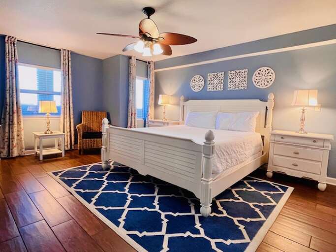 Eye catching coastal art adds color and hints at the beach just outside.