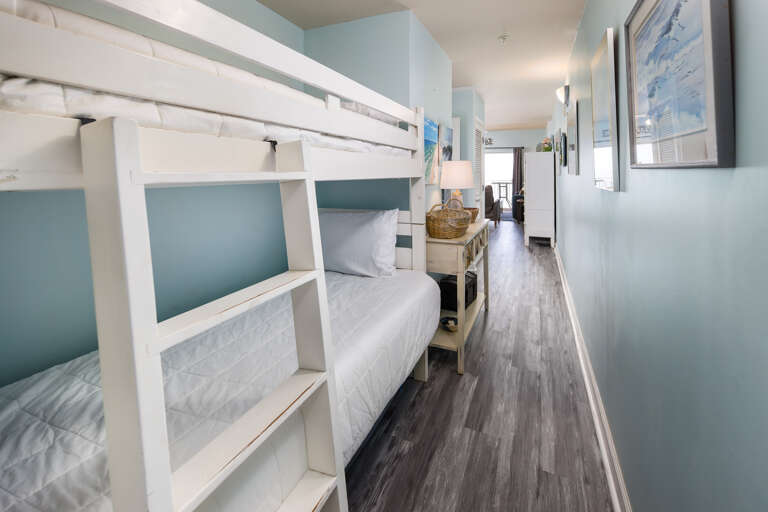 Greatly appreciated by our younger guests, the bunk area offers space-saving accommodations for two with own TV's. Greatly appreciated by our younger guests, the bunk area offers space-saving accommodations for two with own TV's.
