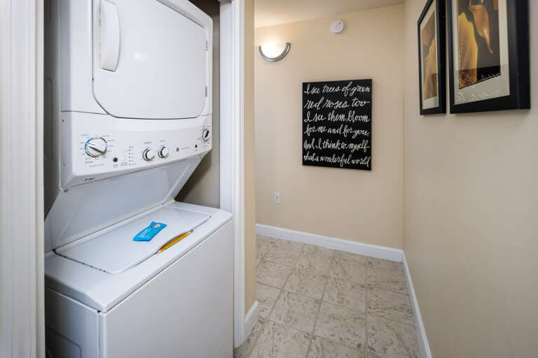 A stacked washer/dryer combo is available in the utility area off the main hallway.