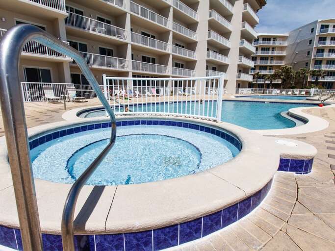 The beach front pool area has two pools and a hot tub!