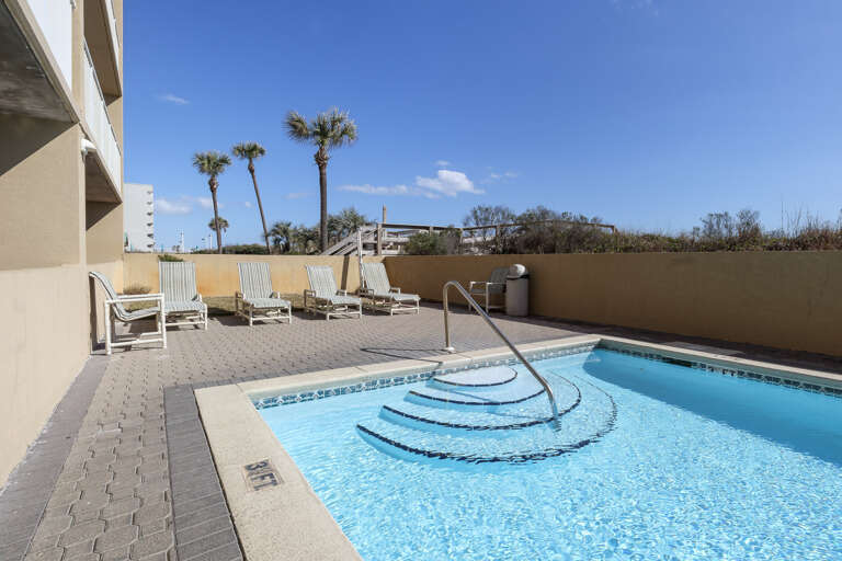 Beachfront pool with lots of lounging deck space