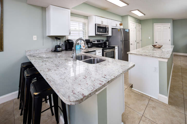 This spacious and updated kitchen has stainless steel appliances and granite. Enjoy some beach front cooking! This spacious and updated kitchen has stainless steel appliances and granite. Enjoy some beach front cooking!