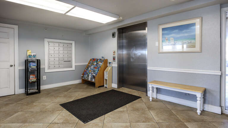 Indoor lobby with elevator access. Indoor lobby with elevator access.
