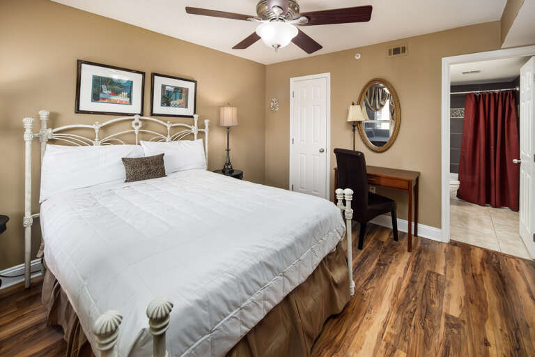 Comfy queen sized bed and private bathroom to the side