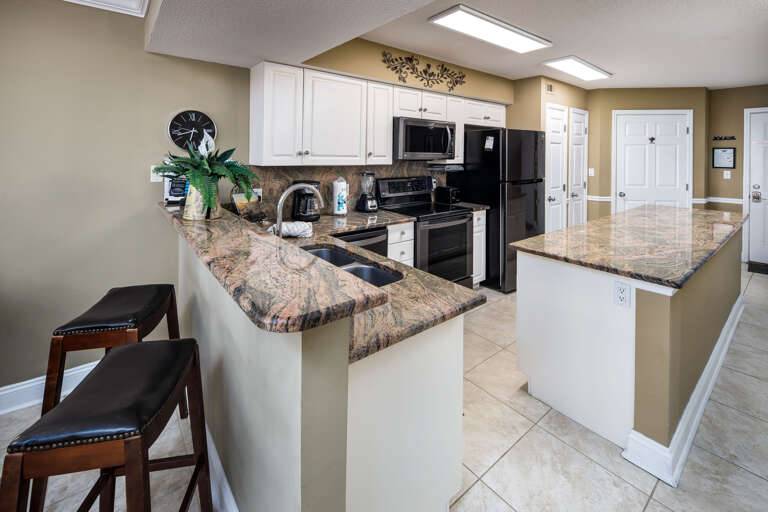 The granite counter tops, island, and all the space and storage - YES PLEASE!