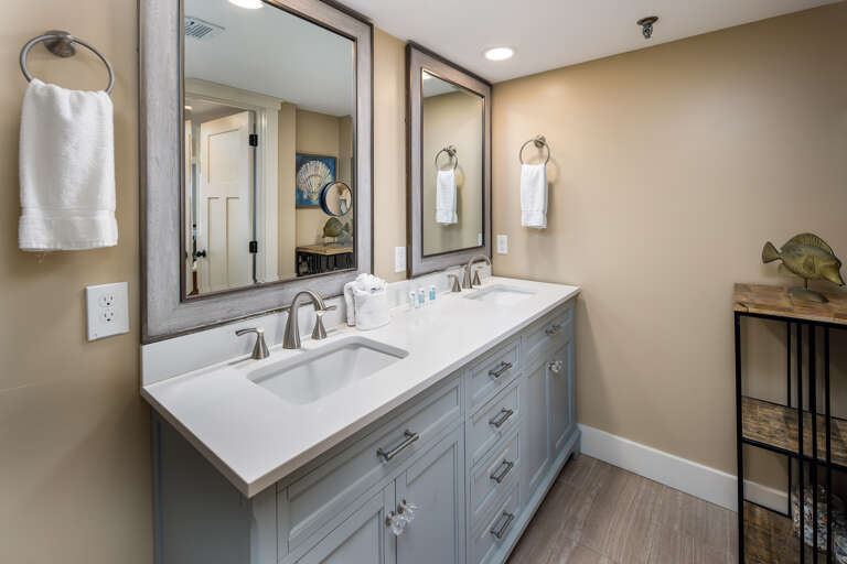 Master bath view with his and her vanity sinks; perfect for a quick clean-up before a night on the town!