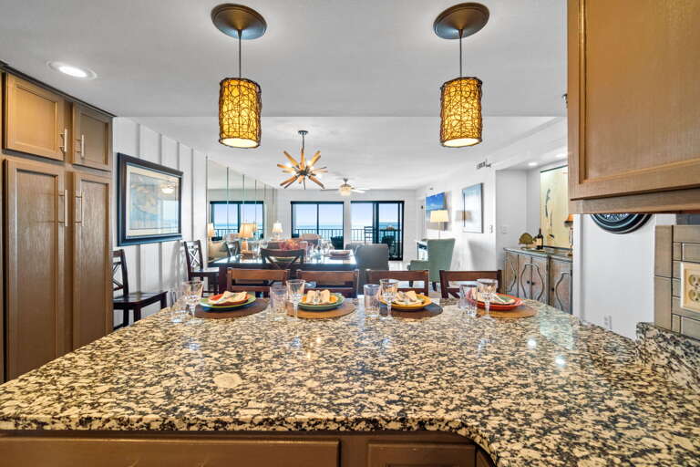 From the kitchen looking into the dining and living area and all the way out to the Gulf.